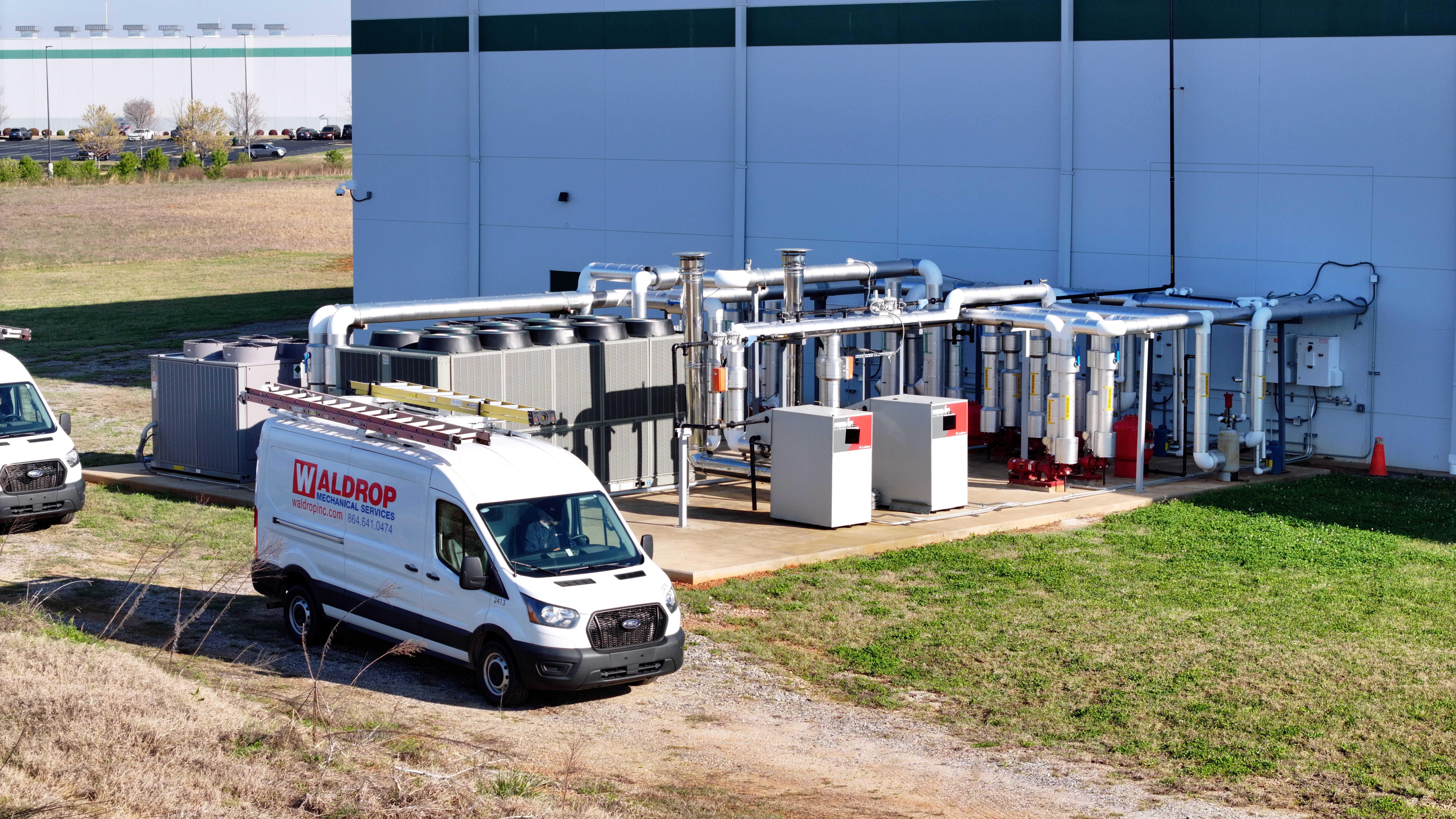 Commercial HVAC installation with service van