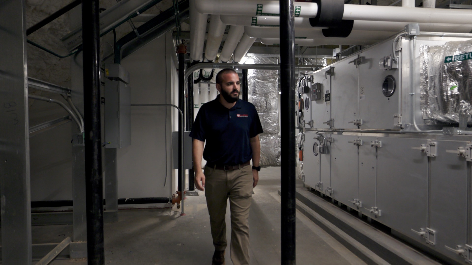 Technician Inspecting Indoor HVAC System