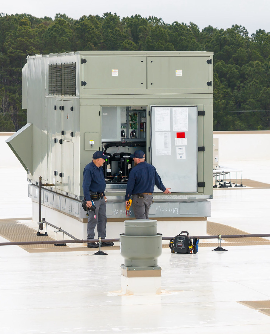 HVAC Technicians Servicing Rooftop Unit